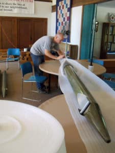 Technician, Owen Rasmussen, carefully wrapping large metal pipes at Martin Luther Lutheran Church, Youngstown OH
