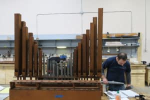 Technician Sean Estanek, creating pipe layout for the wiring of the wind chest at Leek Pipe Organ Company, Berea, OH