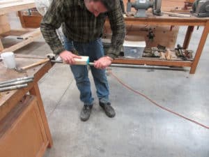 Voicer Sean Estanek, voicing & repairing pipes at shop in Berea, Ohio