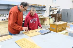 James Leek & Assistant rebuilding Great Division rack boards, Leek Pipe Organ Company, Berea, OH