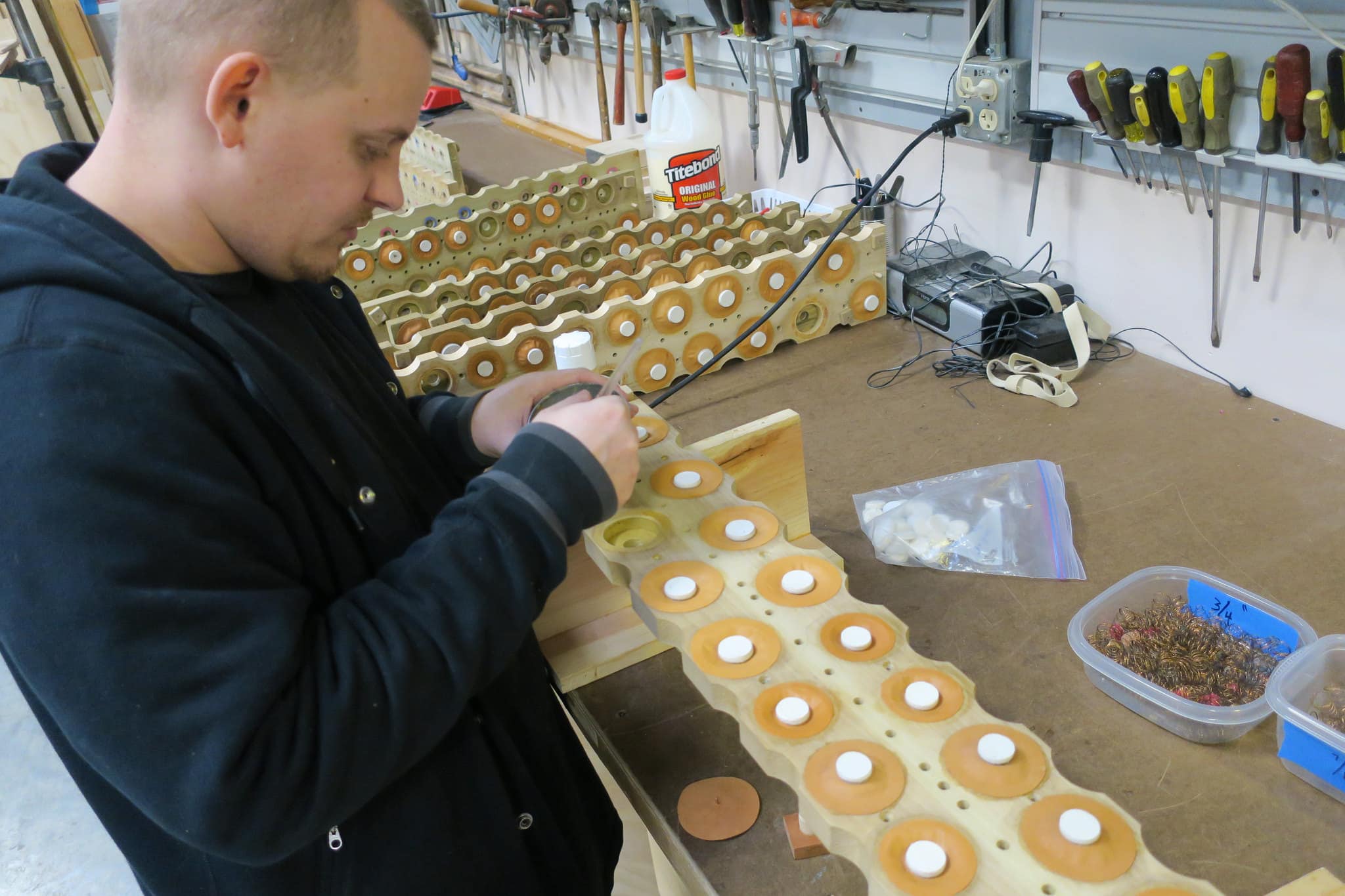 Electro- pneumatic wind chest rebuild with new brown tan leather pouches & springs, at Leek Pipe Organ Company, Berea, Ohio