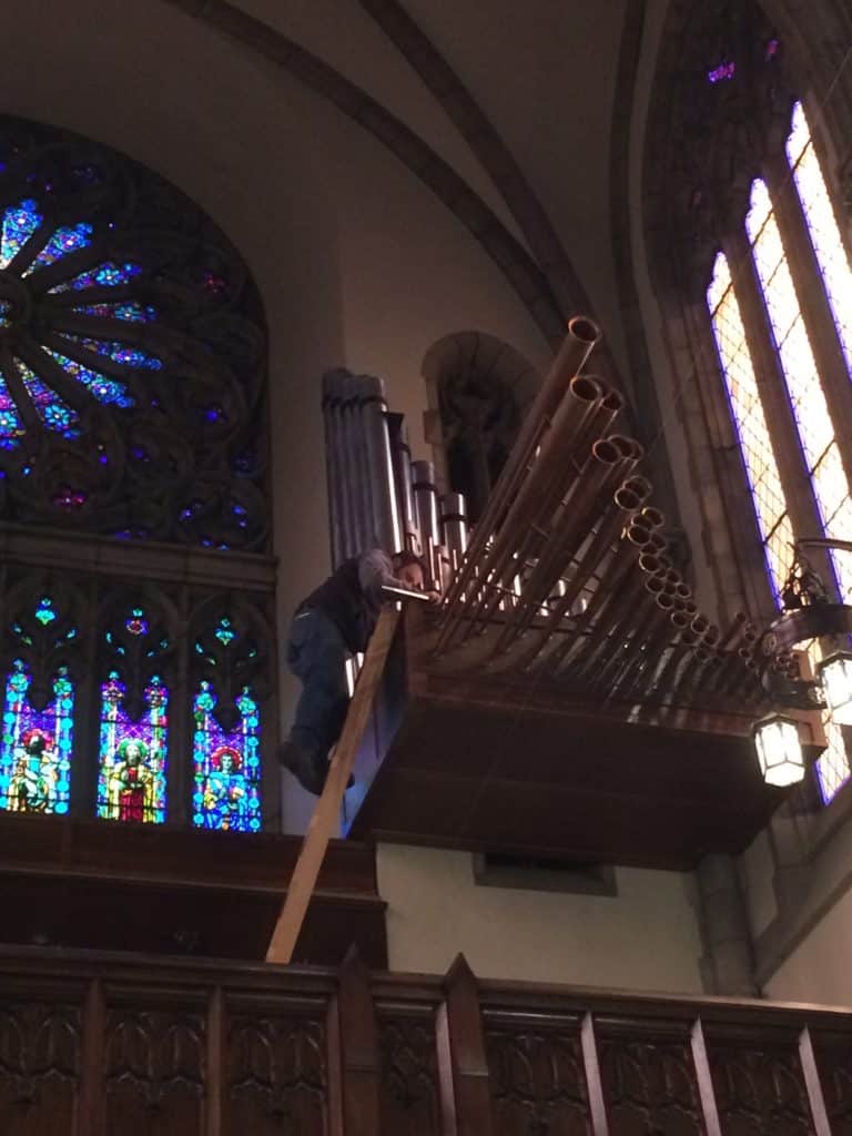 Technician, Sean Estanek tuning the Antiphonal Division of Berghaus Pipe Organ