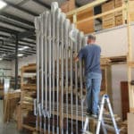 Technician Wayne, testing strength of recently built racking