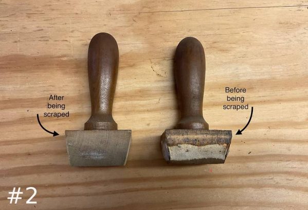 Two wooden organ pipe stoppers on a wooden surface with text labels: the left one is "After being scraped" and the right one is "Before being scraped."